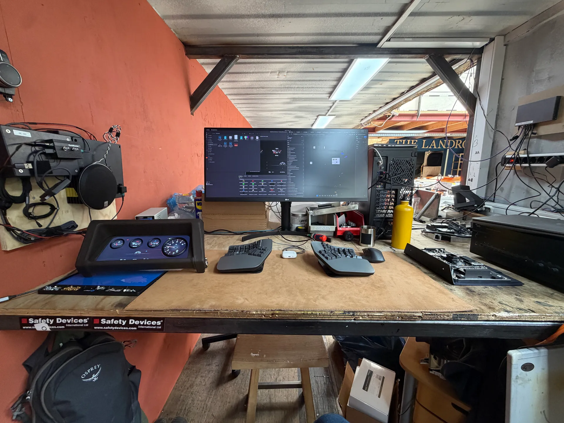 HMI development workbench with a working digital instrument cluster, software monitor and connected test hardware.